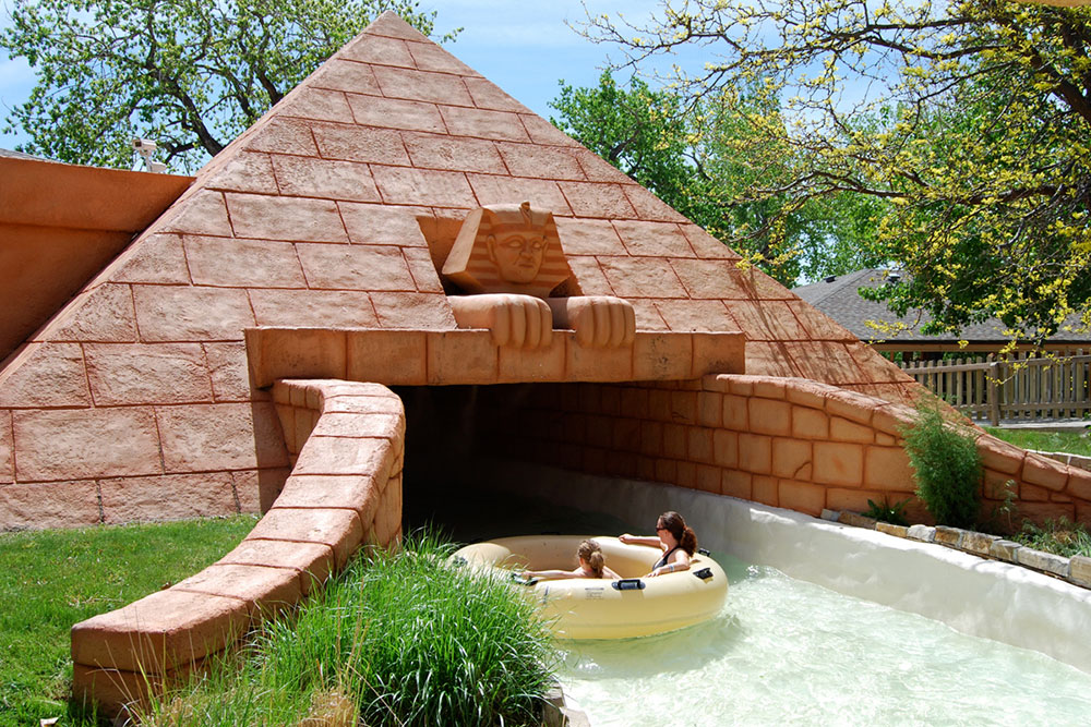 Lost River of the Pharaoh's attraction entrance, mother and daughter on water tube, Pyramid, Egyptian style water ride
