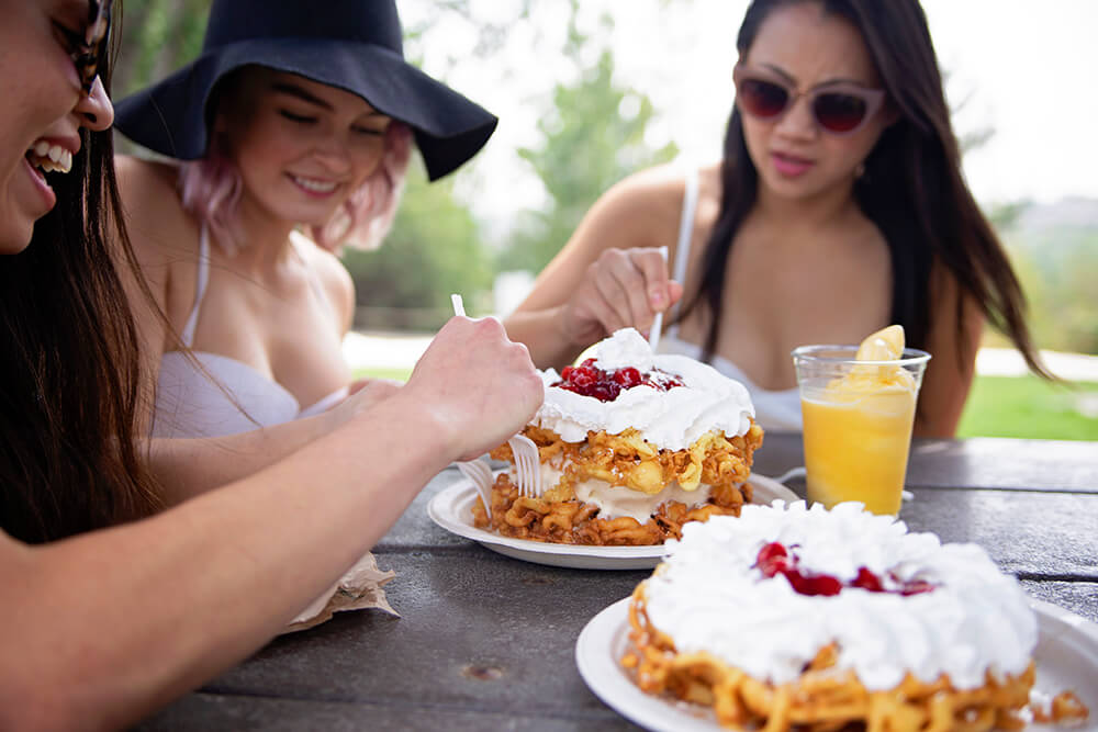 Season_Passes_Image Young Ladies Eating Dessert
