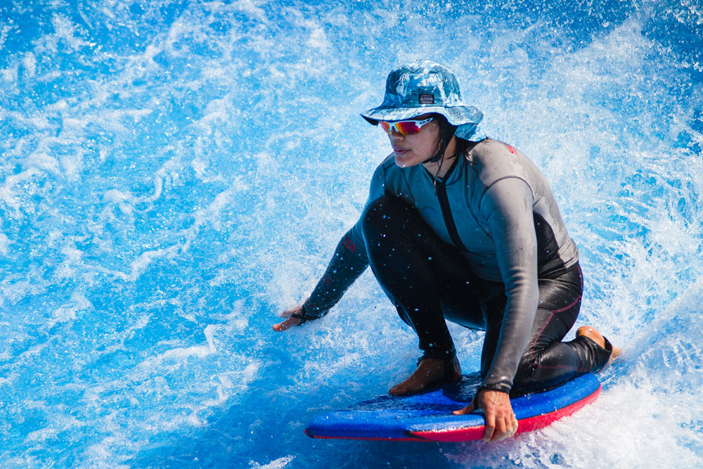 Woman on water board at The Wave, Water World